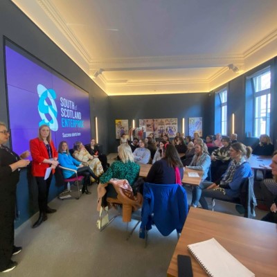 People gathered in a large meeting room